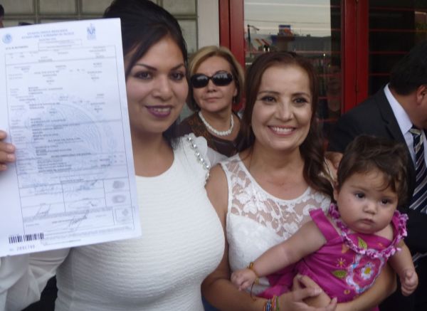 Newlyweds Zaira Viridiana de la O Gomez (left) and Martha Sandoval Blanco with their daughter Sabina. P1030311a