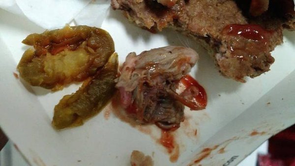 McDonalds claims a drunk customer planted the rat meat in an extortion attempt.
