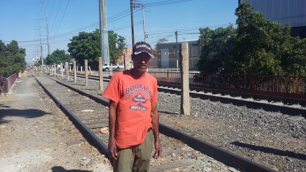 A Honduran migrant from San Pedro Sula, the world's murder capital, beside the train tracks in Guadalajara.