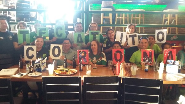 Corona's family cheering him on at a bar in Hermosillo.